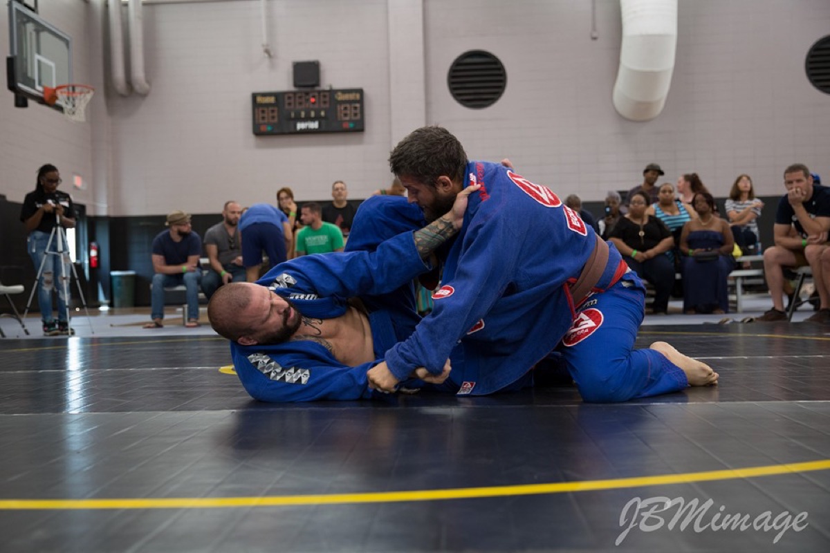 Gi match with both competitors in blue gis
