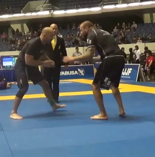 Sonny Parlin squaring up with an opponent at an IBJJF no-gi tournament
